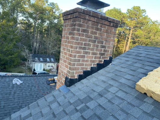 Chimney Flashing - This is an example of a chimney flashing we did, as you can see we ensure that it has a much cleaner and esthetic appearance while it still protects against any future leaks and damages. Chimney Flashing - This is an example of a chimney flashing we did, as you can see we ensure that it has a much cleaner and esthetic appearance while it still protects against any future leaks and damages.