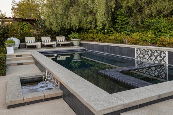 New Pool and Spa in Del Sur - This newly constructed pool and spa features a stunning raised wall with custom tile and an automatic pool cover for convenience and safety.
Why It Works:
- Raised Wall with Custom Tile: The raised wall adds a visually striking element to the pool, creating a sense of grandeur while the custom tile design offers a touch of personal style.
- Automatic Pool Cover: The automatic cover ensures that the pool stays secure, helps with heating efficiency, and reduces maintenance, making it a great addition for both safety and convenience.
- Modern and Functional: The design of the pool and spa offers the perfect balance of style and functionality, providing a luxurious yet practical outdoor space. New Pool and Spa in Del Sur - This newly constructed pool and spa features a stunning raised wall with custom tile and an automatic pool cover for convenience and safety.
Why It Works:
- Raised Wall with Custom Tile: The raised wall adds a visually striking element to the pool, creating a sense of grandeur while the custom tile design offers a touch of personal style.
- Automatic Pool Cover: The automatic cover ensures that the pool stays secure, helps with heating efficiency, and reduces maintenance, making it a great addition for both safety and convenience.
- Modern and Functional: The design of the pool and spa offers the perfect balance of style and functionality, providing a luxurious yet practical outdoor space.