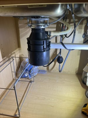 Garbage disposal - Changed out old leaking and jammed garbage disposal for a new ne