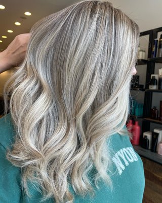 Highlights - Highlighting hair means isolating select strands in the hair and treating them with a haircolor or lightener to make them lighter than their base/natural color.