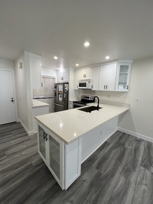 Home Remodeling - This remodel was done on an old kitchen and bathroom that was water damaged. We gutted it and put in new cabinets and appliances to match the tone and added in a custom backsplash. The kitchen was completely flipped. New shower, tile installation and plumbing. The floor was demolished and installed new tiles. The owner absolutely loved the result. Home Remodeling - This remodel was done on an old kitchen and bathroom that was water damaged. We gutted it and put in new cabinets and appliances to match the tone and added in a custom backsplash. The kitchen was completely flipped. New shower, tile installation and plumbing. The floor was demolished and installed new tiles. The owner absolutely loved the result.