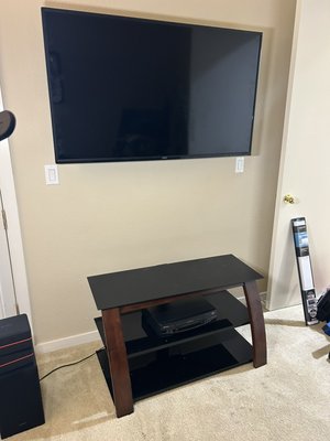 TV Installation with Hidden Wiring - Wall-mounted a TV with hidden power and HDMI cables. Installed in-wall cable plates at top and bottom for a clean, professional finish. All wires are concealed inside the wall, leaving no visible mess.