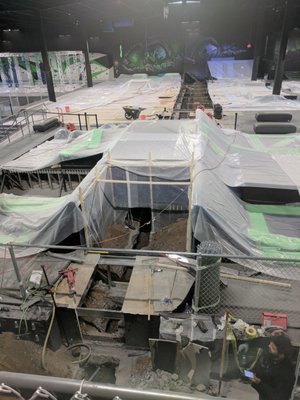 Trampoline park 100 Feet of pipe replaced in 3 days - During the opening weekend of a local trampoline park, we were called in for an emergency repair.  The sewer pipe was not operational and needed to be replaced.  Over 20,000 SF of the facility was covered with dust protection and 100 feet of pipe was replaced by hand digging method in 3 days.  The pipe was located up to 6 feet deep under over 10-inch thick reinforced concrete.  Over 20 men worked around the clock for 3 days to achieve this repair.