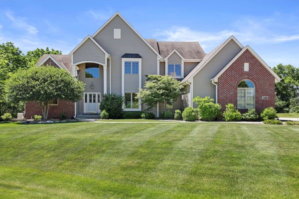 Recently Sold Listing - Superb Trustway built contemporary home situated on 1.5 acres in a quiet cul de sac in New Berlin's Rolling Meadow Estates. 2 story great room is flooded with natural light. Main floor master suite with 2 closets, dual sinks, walk in shower & soaking tub. Main floor office. Beautiful kitchen w/maple cabinetry, hardwood floors, granite countertops, & breakfast bar. Dining area w/sliding doors leads to concrete paver patio, private backyard and a relaxing inground heated pool w/pool shed. Exceptional lower level rec room features custom wet bar with ice maker, fridge, granite countertops, 3rd full bath, a work out area, & separate stairs to access the heated garage. Newer windows, patio, pool heater /liner, & A/C. Back up natural gas generator. Room for addt'l building/garage. Impressive!!