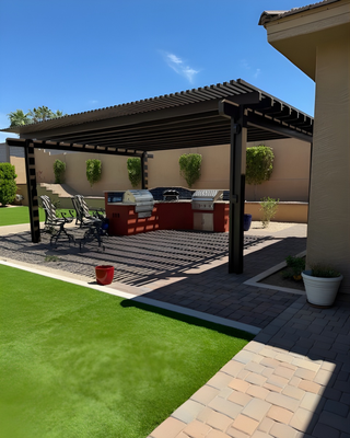 Entertaining Hub in Peoria - This backyard got a major upgrade - we started with a clean slate: removed queen palms + citrus trees, cleared select plants, moved existing granite to the side, handled grading, and took care of hauling/dumping so the new layout could shine.

Then we brought the “outdoor kitchen goals” to life:
✅ Gas + electric utilities trenched and run to the BBQ area
✅ Irrigation updates for a healthier, cleaner system
✅ The centerpiece: a 15’ BBQ island with a backsplash + stainless setup
— Travertine top + Turbo 4 grill, Ooni pizza oven, charcoal grill, griddle
— Access door, utensil drawer, install kit
— Finished with stucco + paint surround
— Deco tile backsplash + turndown for a polished custom look
✅ Concrete pavers expanded the entertainment footprint
— BBQ patio + walkway to the garden area + filled in patio space near the garden
✅ Desert-fresh finishing touches
— 6 tons of ½” screened Mad Gold granite
— New plant palette: 3 tall accent trees, 15 five-gallon plants, plus 2 citrus trees
✅ Lighting ✨
✅ And the comfort-maker: Alumawood shade structure

End result: a true Peoria entertaining hub—shade, lighting, pavers, and a kitchen setup that’s ready for BBQ nights and pizza parties. 🍕🔥
