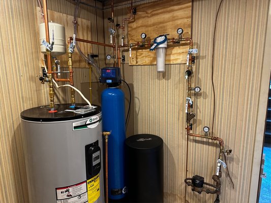 Utility Room Install 2024 - Customer purchased home in Plattsburgh, New York, that needed some TLC. The water is supplied from the town at around 90 psi and the home was missing a pressure reducing valve. To avoid future issues due to very high pressure and fluxuations, we installed a new pressure reducing valve, wye strainer, isolation valves, and pressure gauges (for future diagnosis). The customer also wanted a water softener installed but did not have a sediment filter upstream. So we installed a sediment filter on a plumb board, all with isolation and pressure gauges. Water Softener was installed and drained into a trap and airgap. Water heater was moved and fitted with new isolation, unions, hot supply drain, and expansion tank. We replaced the old sillcocks for garden water with anti-siphon faucets and ran new cold water supply in basement to both sillcock faucets (all insulated with rubber k flex insulation).
Thank you Jim for the business. We are looking forward to the next project! Utility Room Install 2024 - Customer purchased home in Plattsburgh, New York, that needed some TLC. The water is supplied from the town at around 90 psi and the home was missing a pressure reducing valve. To avoid future issues due to very high pressure and fluxuations, we installed a new pressure reducing valve, wye strainer, isolation valves, and pressure gauges (for future diagnosis). The customer also wanted a water softener installed but did not have a sediment filter upstream. So we installed a sediment filter on a plumb board, all with isolation and pressure gauges. Water Softener was installed and drained into a trap and airgap. Water heater was moved and fitted with new isolation, unions, hot supply drain, and expansion tank. We replaced the old sillcocks for garden water with anti-siphon faucets and ran new cold water supply in basement to both sillcock faucets (all insulated with rubber k flex insulation).
Thank you Jim for the business. We are looking forward to the next project!