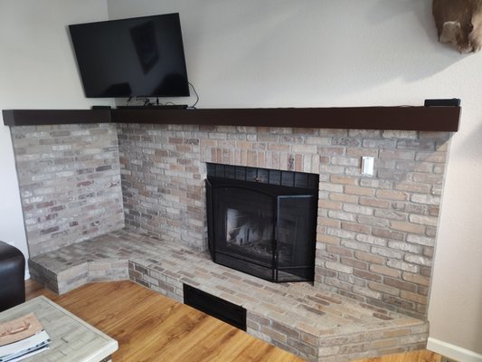 Fireplace Brick Project - This started out being a fireplace surrounded by white walls, we built up the ledge, installed durock, installed the brick, and topped it off with a wrap around mantle! Fireplace Brick Project - This started out being a fireplace surrounded by white walls, we built up the ledge, installed durock, installed the brick, and topped it off with a wrap around mantle!