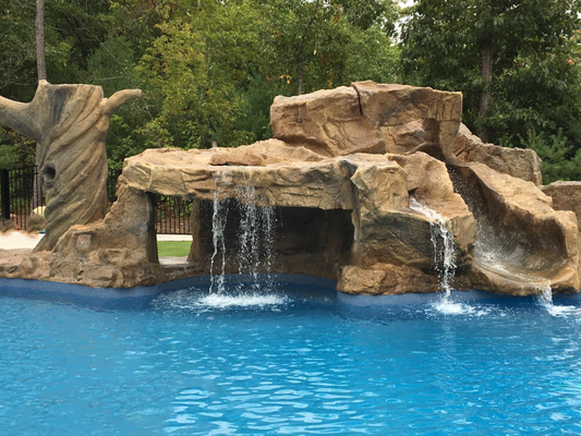 Swimming Pool Waterfall - We build custom pool waterfalls in all shapes and sizes. We can add slides, lighting, grottos, swings, and more. Swimming Pool Waterfall - We build custom pool waterfalls in all shapes and sizes. We can add slides, lighting, grottos, swings, and more.