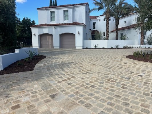 Cameron Tumbled Cobble 6x6x2 - CDL Landscape Inc. did an incredible job on this driveway and planter installation.
The result is a timeless, elegant entrance that perfectly fits the character of this beautiful Spanish-style home.
Every detail was thoughtfully executed, including Cameron Wall Cap (12x2.5") used to border the center tree island and cap the planter walls, with Mac Plus Oatmeal mortar from Orco Products grouted throughout for a clean, refined finish.
It truly is a grand entrance built to last. Cameron Tumbled Cobble 6x6x2 - CDL Landscape Inc. did an incredible job on this driveway and planter installation.
The result is a timeless, elegant entrance that perfectly fits the character of this beautiful Spanish-style home.
Every detail was thoughtfully executed, including Cameron Wall Cap (12x2.5") used to border the center tree island and cap the planter walls, with Mac Plus Oatmeal mortar from Orco Products grouted throughout for a clean, refined finish.
It truly is a grand entrance built to last.