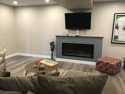 Basement renovation, planning and design - Basement renovation client wishes to remove existing wood burning fireplace, storage closet, moved bathroom to create a better space that’s functional and more appealing towards creating a family room, office, and treadmill. Including adding larger television and electric fireplace with a better seating area that’s more organized and conducive space!
