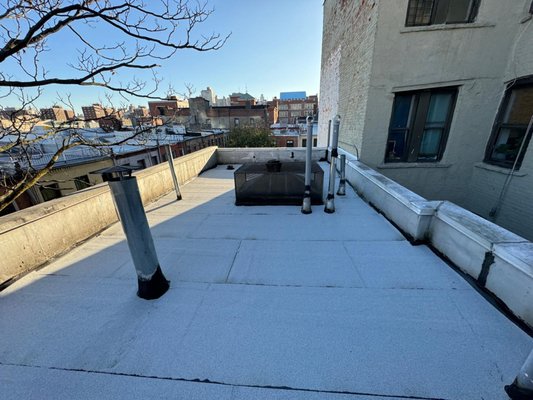 Flat Roof and Siding - BR Contracting Group recently completed a challenging flat roof project in the heart of Manhattan, showcasing our expertise and dedication to quality. The project involved intricate work around numerous metal elements, vent pipes, and custom flashing installations.

The team had to navigate tight urban spaces and coordinate deliveries while ensuring minimal disruption to the building's operations. Despite these challenges, our skilled roofers executed the project flawlessly, installing a durable and weather-resistant membrane that ensures long-term protection against leaks and wear.

This project is a testament to our commitment to delivering "The Best Roofs, Every Time," even under demanding conditions