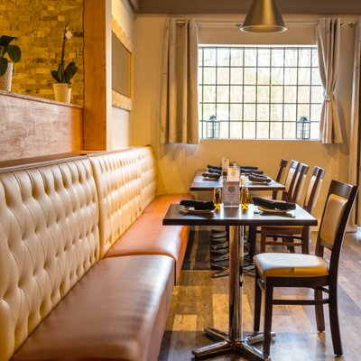 Cellar Bar & Grille Northborough, MA 01532 - Located on Lansdowne Drive in Lexington, Kentucky - The Cellar is a favorite sports bar for many locals.  Our furniture: Custom-made tufted restaurant booths. Custom upholstered chairs.