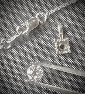 Diamond pendant and chain - This 14 karat white gold pendant and chain were put together using the customers diamond. Diamond pendant and chain - This 14 karat white gold pendant and chain were put together using the customers diamond.