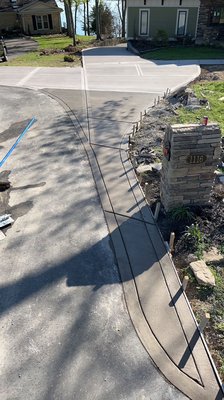 Colored Concrete Driveway - This beautiful driveway in Mt. Juliet TN we just finished a few weeks ago . Customer wanted a large stamped patio and the driveway colored to flow with the brown stamped patio.