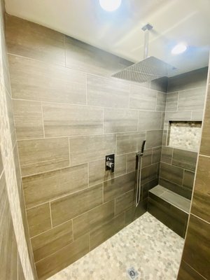 Del Mar Delight: A Bathroom Remodel for Your Coastal Haven - Spyglass Construction is pleased to present a comprehensive bathroom remodeling project in Del Mar, CA, designed to enhance both functionality and aesthetics. Our team of skilled professionals is dedicated to transforming your bathroom into a luxurious and inviting space that meets your unique needs and reflects your personal style.
Key Features:
Rainfall Shower Head: As part of this remodel, we will install a state-of-the-art rainfall shower head that will create a relaxing and invigorating shower experience. The gentle cascade of water will provide a soothing sensation, turning your daily shower into a spa-like retreat.
Mosaic Floor Tiles: To add a touch of elegance and visual interest, we will incorporate mosaic floor tiles into your bathroom. These intricately designed tiles will create a stunning focal point, adding a unique and vibrant element to the overall aesthetic. The mosaic pattern will elevate the entire space, making it both visually appealing and visually stimulating.
Larger Rectangular Darker Tile Walls: To create a modern and sophisticated look, the bathroom walls will feature larger rectangular darker tiles. This choice of tiles will not only provide a sleek and contemporary feel but also add depth and contrast to the overall design. The darker tones will create a sense of warmth and intimacy, while the larger format will contribute to an open and spacious atmosphere.
Our Approach:
At Spyglass Construction, we believe in delivering exceptional craftsmanship combined with attention to detail. Our team of experienced professionals will work closely with you to understand your vision, preferences, and requirements. We will guide you through every step of the process, ensuring that your bathroom remodel meets your expectations in terms of functionality, aesthetics, and budget.
We are committed to using high-quality materials and employing industry-leading techniques to ensure the longevity and durability of the remodel. With our meticulous planning and execution, you can trust that your new bathroom will not only be visually stunning but also built to withstand the test of time. Del Mar Delight: A Bathroom Remodel for Your Coastal Haven - Spyglass Construction is pleased to present a comprehensive bathroom remodeling project in Del Mar, CA, designed to enhance both functionality and aesthetics. Our team of skilled professionals is dedicated to transforming your bathroom into a luxurious and inviting space that meets your unique needs and reflects your personal style.
Key Features:
Rainfall Shower Head: As part of this remodel, we will install a state-of-the-art rainfall shower head that will create a relaxing and invigorating shower experience. The gentle cascade of water will provide a soothing sensation, turning your daily shower into a spa-like retreat.
Mosaic Floor Tiles: To add a touch of elegance and visual interest, we will incorporate mosaic floor tiles into your bathroom. These intricately designed tiles will create a stunning focal point, adding a unique and vibrant element to the overall aesthetic. The mosaic pattern will elevate the entire space, making it both visually appealing and visually stimulating.
Larger Rectangular Darker Tile Walls: To create a modern and sophisticated look, the bathroom walls will feature larger rectangular darker tiles. This choice of tiles will not only provide a sleek and contemporary feel but also add depth and contrast to the overall design. The darker tones will create a sense of warmth and intimacy, while the larger format will contribute to an open and spacious atmosphere.
Our Approach:
At Spyglass Construction, we believe in delivering exceptional craftsmanship combined with attention to detail. Our team of experienced professionals will work closely with you to understand your vision, preferences, and requirements. We will guide you through every step of the process, ensuring that your bathroom remodel meets your expectations in terms of functionality, aesthetics, and budget.
We are committed to using high-quality materials and employing industry-leading techniques to ensure the longevity and durability of the remodel. With our meticulous planning and execution, you can trust that your new bathroom will not only be visually stunning but also built to withstand the test of time.