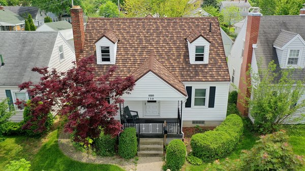 Barrel-Vault Tile Metal Roof - Before and After - The traditional look of High-Barrel Spanish clay tile that enhances your home’s curb appeal.