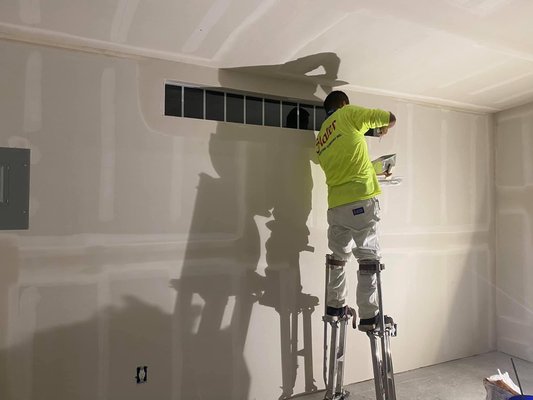 Shed to Gym Conversion Project - In this project, the shed became a gym in which electrical wiring was installed, insulation, speaker wiring, drywall, tape and float, painting, mirror installation, sliding door and window installation, special floor for the gym between other more details.