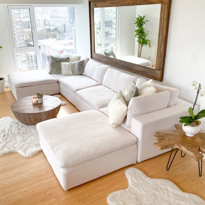 White - Heavenly Cloud Modular Sectional - We build a better CLOUD sofa, manufacture and sell direct at up to 60% Off high end retailers. Our Heavenly Cloud Modular Collection was designed to give you a Cloud sofa experience, but with added durability. The frame is crafted of kiln-dried hardwood with an 8-way, hand tied construction. Our seat cushions have a foam core to help maintain their shape and structure and then are stuffed with a 50-50 fill and feather blend for a plush, soft feel. The back pillows are overstuffed with a 50-50 blend of fill and feather for a slightly more supportive feel.
All our sectionals come slipcovered in stain-resistant, Heavenly Performance Fabric. They wipe clean and are fully removable if you choose to take them off and wash them. making them incredibly kid-friendly and pet friendly. Many of our customers buy two sets of slipcovers to update the look seasonally. We stock four colors in the Performance, linen weave: White, Dove, Charcoal and Carbon.
Our sectionals are available in 3 sizes so you can create the sofa of your dreams to fit your living space. The sizes are 36", 40" and 45". Each piece is outfitted with sturdy metal connectors so you can attach them and easily move them around in any configuration you like.
Call for a Showroom appointment 206-466-9531 or for a FaceTime tour. We ship nationwide! White - Heavenly Cloud Modular Sectional - We build a better CLOUD sofa, manufacture and sell direct at up to 60% Off high end retailers. Our Heavenly Cloud Modular Collection was designed to give you a Cloud sofa experience, but with added durability. The frame is crafted of kiln-dried hardwood with an 8-way, hand tied construction. Our seat cushions have a foam core to help maintain their shape and structure and then are stuffed with a 50-50 fill and feather blend for a plush, soft feel. The back pillows are overstuffed with a 50-50 blend of fill and feather for a slightly more supportive feel.
All our sectionals come slipcovered in stain-resistant, Heavenly Performance Fabric. They wipe clean and are fully removable if you choose to take them off and wash them. making them incredibly kid-friendly and pet friendly. Many of our customers buy two sets of slipcovers to update the look seasonally. We stock four colors in the Performance, linen weave: White, Dove, Charcoal and Carbon.
Our sectionals are available in 3 sizes so you can create the sofa of your dreams to fit your living space. The sizes are 36", 40" and 45". Each piece is outfitted with sturdy metal connectors so you can attach them and easily move them around in any configuration you like.
Call for a Showroom appointment 206-466-9531 or for a FaceTime tour. We ship nationwide!