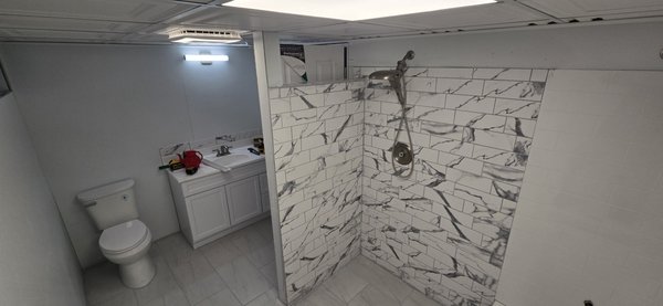 bathroom remodel - This bathroom remodel was done for a large family that needed more room. I expanded the back wall did so.e plumbing electric tile and replaced the toilet vanity medicine cabinet ceiling and lights bathroom remodel - This bathroom remodel was done for a large family that needed more room. I expanded the back wall did so.e plumbing electric tile and replaced the toilet vanity medicine cabinet ceiling and lights