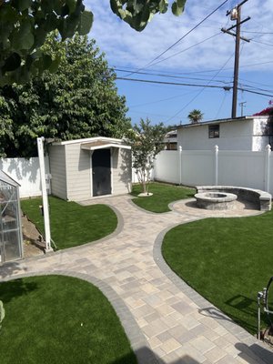 Complete Backyard Transformation with Turf, Pavers, Fire Pit, and Outdoor Lighting - This project involved transforming a dull and underutilized backyard into a beautiful, functional outdoor living space. We incorporated a seamless blend of turf, custom paver walkways, and a cozy fire pit area, all enhanced by elegant outdoor lighting. The result is a modern, welcoming space perfect for relaxation, gatherings, and adding value to the home. The combination of these elements has created a low-maintenance, visually appealing area that can be enjoyed both day and night. Complete Backyard Transformation with Turf, Pavers, Fire Pit, and Outdoor Lighting - This project involved transforming a dull and underutilized backyard into a beautiful, functional outdoor living space. We incorporated a seamless blend of turf, custom paver walkways, and a cozy fire pit area, all enhanced by elegant outdoor lighting. The result is a modern, welcoming space perfect for relaxation, gatherings, and adding value to the home. The combination of these elements has created a low-maintenance, visually appealing area that can be enjoyed both day and night.
