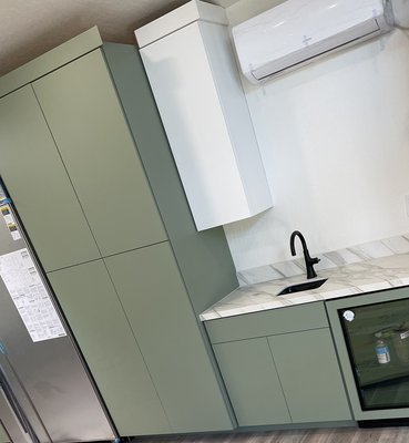 Kitchen remodel in San Mateo Ca - This beautiful kitchen remodel has a two tone contrast with the upper cabinetry being Swiss coffee (white) and the base cabinetry a beautiful olive green satin finish Kitchen remodel in San Mateo Ca - This beautiful kitchen remodel has a two tone contrast with the upper cabinetry being Swiss coffee (white) and the base cabinetry a beautiful olive green satin finish