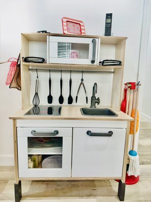Dramatic Play Area. - A Montessori kitchen is a safe space for children to participate in real-world activities like cooking and cleaning. It can help children develop independence, self-confidence, and practical life skills.