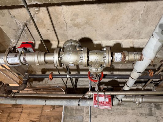 3" riser replacement in San Francisco - This parking garage riser replacement was from 1953 and starting to leak due to electrolysis. The 3" copper supply for the building supplied this 3" steel fire sprinkler riser with no dielectric fitting. The system was drained down with work completed in 1 hour because we planned the repair ahead of time. The 3" thread & grooved dielectric nipple now separates the two metals with a new grooved control valve and check valve. An air groove was put on the existing 3" pipe so we could install a new piece of galvanized pipe into the system. 3" riser replacement in San Francisco - This parking garage riser replacement was from 1953 and starting to leak due to electrolysis. The 3" copper supply for the building supplied this 3" steel fire sprinkler riser with no dielectric fitting. The system was drained down with work completed in 1 hour because we planned the repair ahead of time. The 3" thread & grooved dielectric nipple now separates the two metals with a new grooved control valve and check valve. An air groove was put on the existing 3" pipe so we could install a new piece of galvanized pipe into the system.