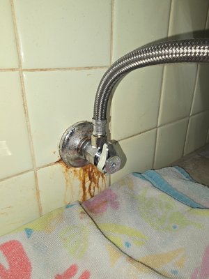 Leaking in the wall - Repaired a leaking galvanized nipple going between the tile. We had to remove the tile carefully and replace leaking fitting with a new brass fitting and stop. We temporarily placed back the tile. Leaking in the wall - Repaired a leaking galvanized nipple going between the tile. We had to remove the tile carefully and replace leaking fitting with a new brass fitting and stop. We temporarily placed back the tile.