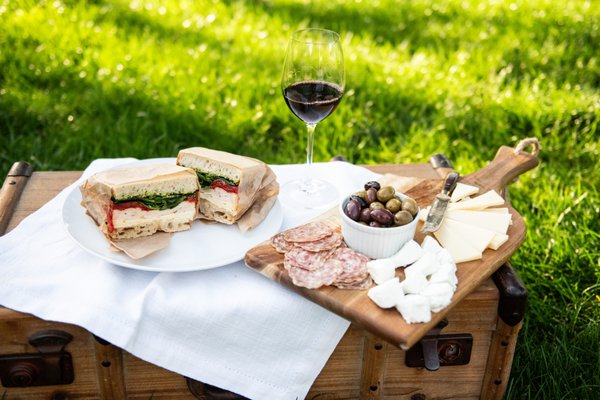 Wine Flight & Picnic Lunch - Enjoy a private wine tasting and delicious boxed lunch on our picnic grounds while visiting our family winery during the spring and summer months. Our fresh seasonal menu options and a flight of Dry Creek Vineyard wines are the perfect complement to your wine country experience. Available for 2-8 people. Please order at least 72 hours in advance. Wine Flight & Picnic Lunch - Enjoy a private wine tasting and delicious boxed lunch on our picnic grounds while visiting our family winery during the spring and summer months. Our fresh seasonal menu options and a flight of Dry Creek Vineyard wines are the perfect complement to your wine country experience. Available for 2-8 people. Please order at least 72 hours in advance.