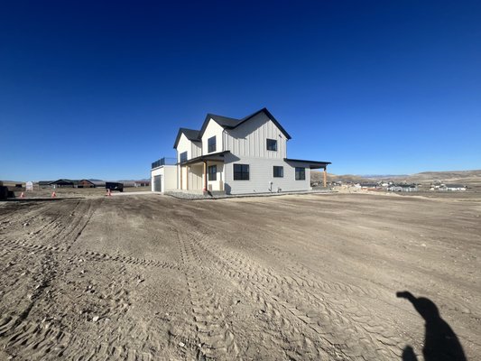 New home landscape - Another new home landscape with fine grading, rock beds, and sod in the spring in partnership with Montana Yard Butler.