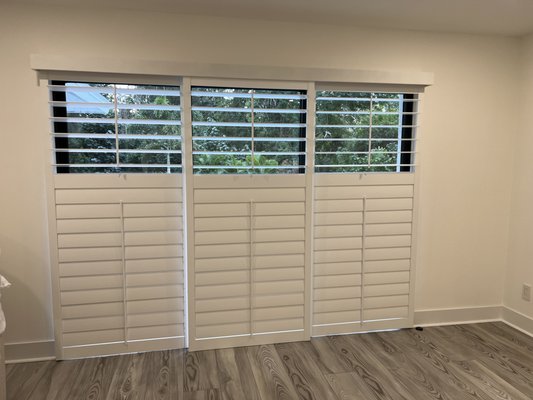 Bypass Shutters - Bypass shutters create a classic look.  They are great for large windows or sliding doors.  They provide privacy and a room-darkening effect.