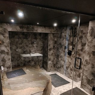 Bathroom remodel - This bathroom was a fun project we have had the privilege on working with the GC. It was a real stone that came out of the earth in the basement of a lake home. One of my favorites! Bathroom remodel - This bathroom was a fun project we have had the privilege on working with the GC. It was a real stone that came out of the earth in the basement of a lake home. One of my favorites!