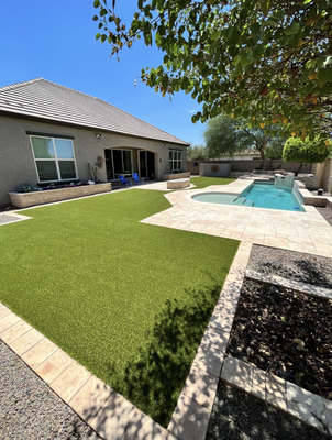 Artificial Turf With Pools - Installing artificial turf around your pool means no more skimming grass clippings or debris from the water! Enjoy your lawn barefoot and jump right in before having to rinse off. Don't let your beautiful pool be overlooked by dry, dead, brown grass. Create a backyard oasis with Southern Turf Co.'s artificial turf installations!