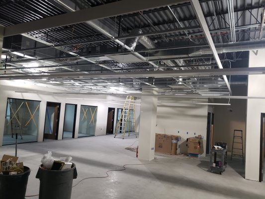 Tenant Finish - This Tenant Finish project involved the complete electrical fit-out of a newly leased retail unit spanning 3,500 square feet. The goal was to provide a modern, efficient, and aesthetically pleasing electrical system that met the specific needs of the tenant.
Scope of Work:
Electrical Layout Design: Our team collaborated closely with the tenant and project architects to design a comprehensive electrical layout that maximized functionality and adhered to local building codes and regulations.
Power Distribution: We installed a robust power distribution system to support the retail space's lighting, HVAC, security systems, and point-of-sale terminals. This included strategically positioned outlets and circuits to accommodate various electrical loads.
Lighting Design and Installation: To create an inviting atmosphere for customers, we designed a custom lighting scheme that combined ambient, task, and accent lighting. LED fixtures were selected for their energy efficiency and longevity. Dimmer switches were installed to allow for flexible lighting control.
Data and Communication Infrastructure: In anticipation of the tenant's technology needs, we installed structured cabling to support data, voice, and video services. This included network wiring, phone lines, and cable TV connections.
Safety and Compliance: Ensuring the safety of both occupants and property was paramount. We installed smoke detectors, emergency lighting, and exit signs in compliance with local fire and building codes.
Outcome:
This Tenant Finish was completed on schedule and within budget. The tenant was thrilled with the quality of workmanship and attention to detail demonstrated by our team. The finished space not only met but exceeded their expectations, providing a functional and visually appealing environment for conducting business. Tenant Finish - This Tenant Finish project involved the complete electrical fit-out of a newly leased retail unit spanning 3,500 square feet. The goal was to provide a modern, efficient, and aesthetically pleasing electrical system that met the specific needs of the tenant.
Scope of Work:
Electrical Layout Design: Our team collaborated closely with the tenant and project architects to design a comprehensive electrical layout that maximized functionality and adhered to local building codes and regulations.
Power Distribution: We installed a robust power distribution system to support the retail space's lighting, HVAC, security systems, and point-of-sale terminals. This included strategically positioned outlets and circuits to accommodate various electrical loads.
Lighting Design and Installation: To create an inviting atmosphere for customers, we designed a custom lighting scheme that combined ambient, task, and accent lighting. LED fixtures were selected for their energy efficiency and longevity. Dimmer switches were installed to allow for flexible lighting control.
Data and Communication Infrastructure: In anticipation of the tenant's technology needs, we installed structured cabling to support data, voice, and video services. This included network wiring, phone lines, and cable TV connections.
Safety and Compliance: Ensuring the safety of both occupants and property was paramount. We installed smoke detectors, emergency lighting, and exit signs in compliance with local fire and building codes.
Outcome:
This Tenant Finish was completed on schedule and within budget. The tenant was thrilled with the quality of workmanship and attention to detail demonstrated by our team. The finished space not only met but exceeded their expectations, providing a functional and visually appealing environment for conducting business.