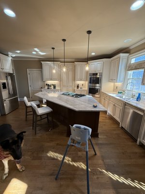 Braselton Kitchen Modernization - This project involved a full kitchen update in Braselton, transforming the space with a modern design and improved functionality. The original marble countertops were removed during demolition, leaving the existing cabinetry in place for a clean transition to the new layout.

A new center island was installed along with upgraded marble countertops, a modern backsplash, and new appliances, including a stove and oven. A custom walkway bar counter was also added, designed to hold wine glasses, wine bottles, and liquor, creating a functional and stylish bar area within the kitchen.

The result is a refreshed, cohesive kitchen that blends updated materials, improved workflow, and a clean, modern aesthetic tailored to the home.
