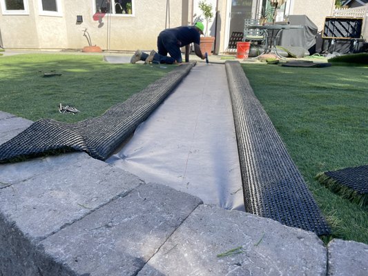 Perfect, clean, flowing, landscape, with retaining wall, flagstone, palms, dry river bed, boulders, trees, grasses - One of my clients gave me full permission to design and install her backyard. I found a large area with a slope, which i turned it into usable space. I built a Europa retaining wall and installed synthetic turf. The wall added a significant integrity to the landscape. I also built stairs and flagstone walkway to accompany the landscape. Perfect, clean, flowing, landscape, with retaining wall, flagstone, palms, dry river bed, boulders, trees, grasses - One of my clients gave me full permission to design and install her backyard. I found a large area with a slope, which i turned it into usable space. I built a Europa retaining wall and installed synthetic turf. The wall added a significant integrity to the landscape. I also built stairs and flagstone walkway to accompany the landscape.