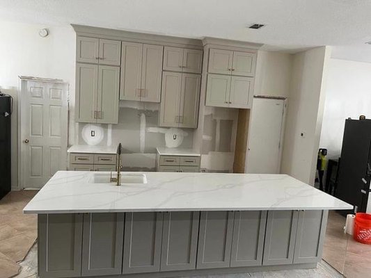 A newly kitchen remodel ￼ - This remodel was done from start to finish in 3 weeks. They even added a cabinet for their dogs on the left side of the kitchen island and ran water tap to fill up the water bowls!