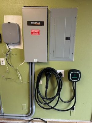 Electric vehicle charging station - This client recently purchased an electric vehicle and charging station. We also installed a Generac generator for them. Electric vehicle charging station - This client recently purchased an electric vehicle and charging station. We also installed a Generac generator for them.