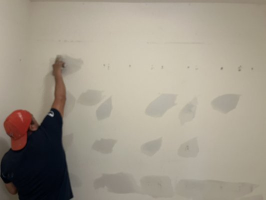 Wall repair and repaint - The client dismantled and removed a intricate closet racking system out of their closet. The end result was gaping holes littered all through the walk in closet. We were able to not only fill the holes, but also paint the wall. The pictures don’t do it justice.