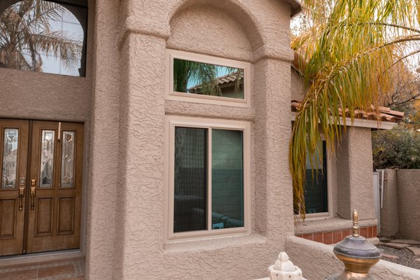 Henderson Install - This home purchased Almond windows with blue glass for energy efficiency.