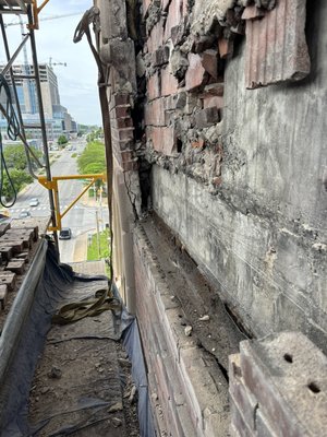 Exterior brick building facial repair and replacement - (Historical Building)owner noticed bowing on the 8 & 9th floor exterior brick facial. Due to poor drainage, deteriorating brick and mortar and weather conditions.