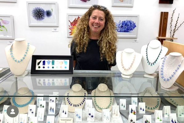 Staci Adman - Staci's jewelry is made from recycled glass bottles, some salvaged from bygone beach dump sites on Washington's Olympic Peninsula, using a technique called 'lampwork'.