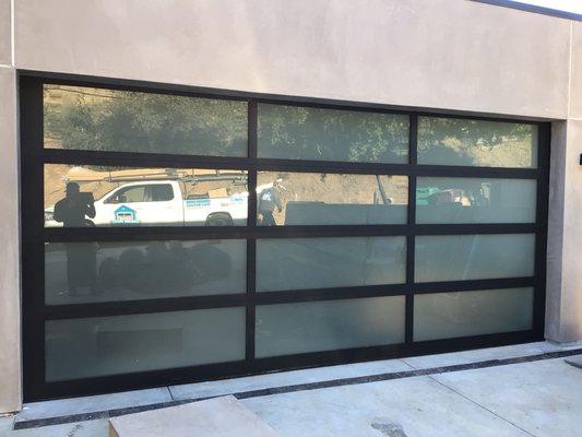 Full-View Aluminum Collection - Find the perfect blend of industrial and ultra-modern with a full-view aluminum glass garage door.
Made from durable, heavy-duty aluminum and expertly engineered, you can choose from a huge range of style options and colors to design your perfect contemporary door.
Made of durable, low-maintenance aluminum
Suitable for all climates
Sound transmission class (STC) rating of 27
Optional polystyrene insulation for additional thermal protection
Comes with a limited lifetime warranty
Make it your own with:
188 colors
Standard and specialty glass options Full-View Aluminum Collection - Find the perfect blend of industrial and ultra-modern with a full-view aluminum glass garage door.
Made from durable, heavy-duty aluminum and expertly engineered, you can choose from a huge range of style options and colors to design your perfect contemporary door.
Made of durable, low-maintenance aluminum
Suitable for all climates
Sound transmission class (STC) rating of 27
Optional polystyrene insulation for additional thermal protection
Comes with a limited lifetime warranty
Make it your own with:
188 colors
Standard and specialty glass options