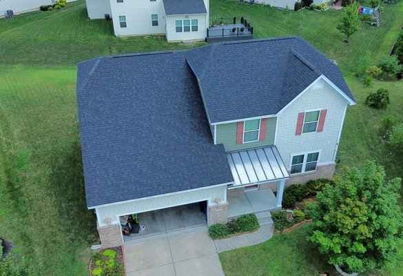 Zionsville House - We had the privilege of bringing new life to this stunning home with a roof that’s as durable as it is beautiful. We used Owens Corning Duration FLEX shingles in the elegant Onyx Black—a color that adds bold contrast and timeless style. These shingles aren’t just about looks—they’re built with SureNail® Technology and SBS polymer modification for superior flexibility, impact resistance, and long-lasting performance. Style meets strength, and this home is ready to stand up to whatever nature brings.