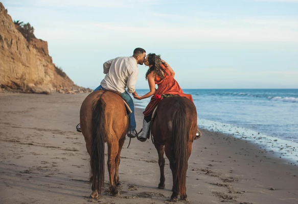 Proposals - Proposals-
We’re here to help. We have taken our guests most requested items for their special moment and made an all inclusive package. Each package can be customized to meet your needs and requests. From the horses to the photographer, we have everything covered!
What's Included:
Beach or Trail Ride for 2-
Choose between either the 90 minute Beach or Trail Ride. A wrangler will guide you throughout your experience.
Extra 30 Minutes-
This extra time is used for the proposal, pictures, blanket and pillow set up.
Photographer-
A professional photographer that is knowledgable with our animals and has done all of the amazing photos you see here. Package includes 10 professionally edited photos. You will receive your photos 7-10 business days after your ride.
Sparkling Non Alcoholic Cider-
We provide glasses and cider for your special moment. Want to bring Champagne? No problem!
Roses-
One bouquet of roses is used for petals to spread around the blanket, and we leave some on the stem for photos. Many guests have added extra roses for an additional fee.
Decor-
Blanket, pillows, wooden sign (Wooden sign is used on the beach only). We take care of the set up and clean up so you can ride off into the sunset! Want to add more to the set up? No problem! Give us a call to customize your special day even more.
Automatic Gratuity-
The gratuity is split between wrangler, photographer and set up/clean up person.
Additions-
Fruit, crackers and cheese plate $50 / Raw Photos $50.
Total: $1050 Plus Taxes and Booking Fee Proposals - Proposals-
We’re here to help. We have taken our guests most requested items for their special moment and made an all inclusive package. Each package can be customized to meet your needs and requests. From the horses to the photographer, we have everything covered!
What's Included:
Beach or Trail Ride for 2-
Choose between either the 90 minute Beach or Trail Ride. A wrangler will guide you throughout your experience.
Extra 30 Minutes-
This extra time is used for the proposal, pictures, blanket and pillow set up.
Photographer-
A professional photographer that is knowledgable with our animals and has done all of the amazing photos you see here. Package includes 10 professionally edited photos. You will receive your photos 7-10 business days after your ride.
Sparkling Non Alcoholic Cider-
We provide glasses and cider for your special moment. Want to bring Champagne? No problem!
Roses-
One bouquet of roses is used for petals to spread around the blanket, and we leave some on the stem for photos. Many guests have added extra roses for an additional fee.
Decor-
Blanket, pillows, wooden sign (Wooden sign is used on the beach only). We take care of the set up and clean up so you can ride off into the sunset! Want to add more to the set up? No problem! Give us a call to customize your special day even more.
Automatic Gratuity-
The gratuity is split between wrangler, photographer and set up/clean up person.
Additions-
Fruit, crackers and cheese plate $50 / Raw Photos $50.
Total: $1050 Plus Taxes and Booking Fee
