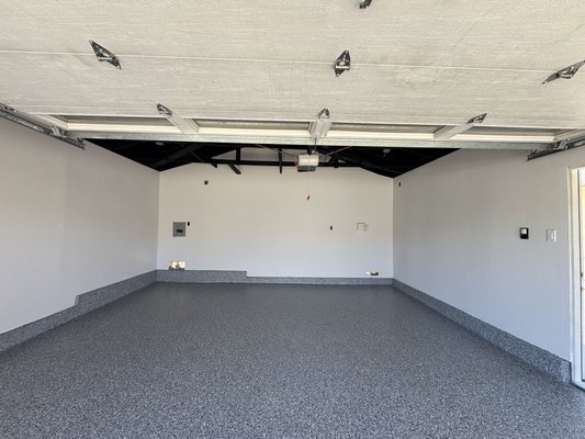 Garage remodeling - Complete garage remodel featuring new drywall, fresh paint, a black exposed ceiling, and a durable epoxy floor coating. Garage remodeling - Complete garage remodel featuring new drywall, fresh paint, a black exposed ceiling, and a durable epoxy floor coating.