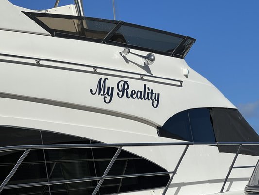 Charter This 65' Yacht Today (My Reality) - This 65' flybridge motor yacht is an exceptional example of what can be done in a custom yacht. On either side of the curved salon doorway are steps leading up to the bow where you can soak up the sun on comfortable sun pads. Take the stairs up to the flybridge where you'll find a perfect entertaining space. There is a covered table with wrap-around seating, a wet bar with fridge, and a lounge area for sunning. If you prefer to watch as the yacht cruises forward, there is also a perch in front of helm with sun filled soft cushions. Upon stepping into the main salon, the large tile flooring has sofa seating to port and starboard with an ottoman in between them to put up your feet or flip around to put down your favorite drink. Across you'll find a fully functioning galley with a full-size fridge, dishwasher, four-burner cooktop, and convection oven. To access the staterooms, a carpeted spiral staircase leads down to the living quarters where you will find 3 statrooms and 3 bathrooms. Charter This 65' Yacht Today (My Reality) - This 65' flybridge motor yacht is an exceptional example of what can be done in a custom yacht. On either side of the curved salon doorway are steps leading up to the bow where you can soak up the sun on comfortable sun pads. Take the stairs up to the flybridge where you'll find a perfect entertaining space. There is a covered table with wrap-around seating, a wet bar with fridge, and a lounge area for sunning. If you prefer to watch as the yacht cruises forward, there is also a perch in front of helm with sun filled soft cushions. Upon stepping into the main salon, the large tile flooring has sofa seating to port and starboard with an ottoman in between them to put up your feet or flip around to put down your favorite drink. Across you'll find a fully functioning galley with a full-size fridge, dishwasher, four-burner cooktop, and convection oven. To access the staterooms, a carpeted spiral staircase leads down to the living quarters where you will find 3 statrooms and 3 bathrooms.