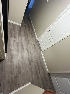 Free float floor install - 1000sqft of free flat vinyl flooring with baseboards. Barn style sliding door install