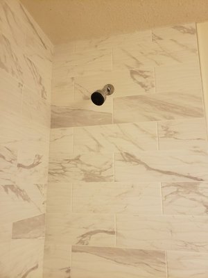 Partial Bathroom Remodeling - This was a partial bathroom remodeling with new tub, new shower faucet, water proof boards behind tile, new tile on wall, niche installation Partial Bathroom Remodeling - This was a partial bathroom remodeling with new tub, new shower faucet, water proof boards behind tile, new tile on wall, niche installation
