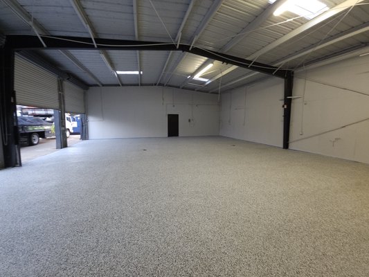 Warehouse Epoxy - we went into this project with grease all over the place. we first pressure washed with a degreaser and then followed with a complete floor grinding. We then took a day to roll epoxy and throw flakes. We then came the next day to add our clear coat after letting epoxy settle down into the concrete overnight. The floor looks awesome, and the customer loved it just as much as we did. Warehouse Epoxy - we went into this project with grease all over the place. we first pressure washed with a degreaser and then followed with a complete floor grinding. We then took a day to roll epoxy and throw flakes. We then came the next day to add our clear coat after letting epoxy settle down into the concrete overnight. The floor looks awesome, and the customer loved it just as much as we did.